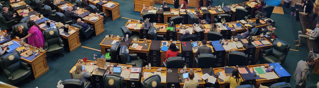 Meeting of the Colorado state assembly with lawmakers seated at their desks