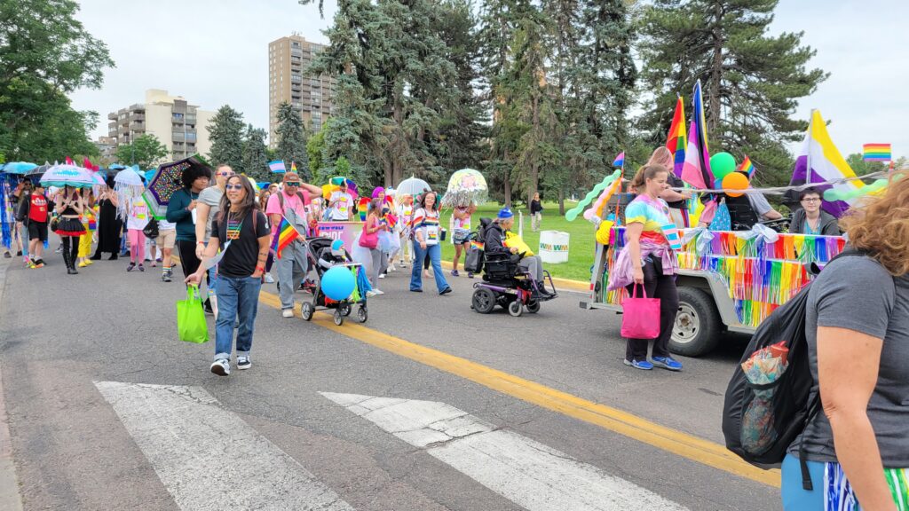 CCDC representatives walking in pride parade