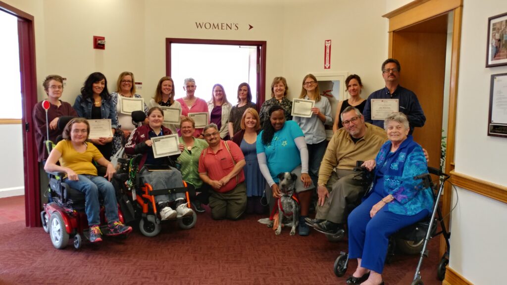Spring 2017  Advocacy Class Graduates and CCDC Staff posing with their certificates and smiling